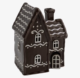 Foto av en stämningsfull ljuslykta i pepparkakshusform