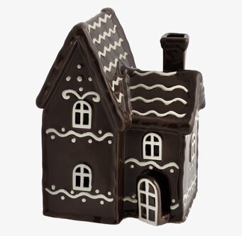 Bild av pepparkakshus som ljuslykta med glasyr