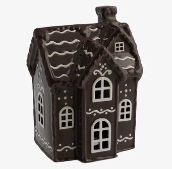 Bild av en charmig ljuslykta i pepparkakshusdesign