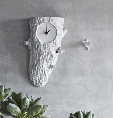 Bild av dekorativ väggklocka med naturinspiration
