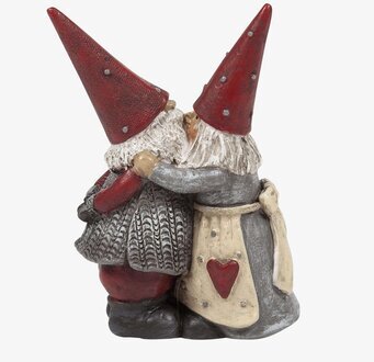 Bild av två tomtar i varm omfamning för juldekoration