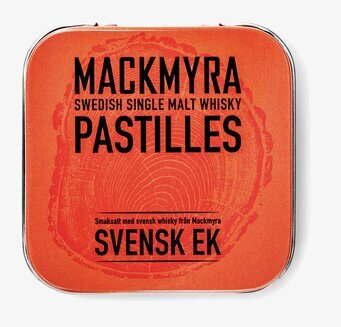 Bild av orange plåtask med whisky-inspirerad design