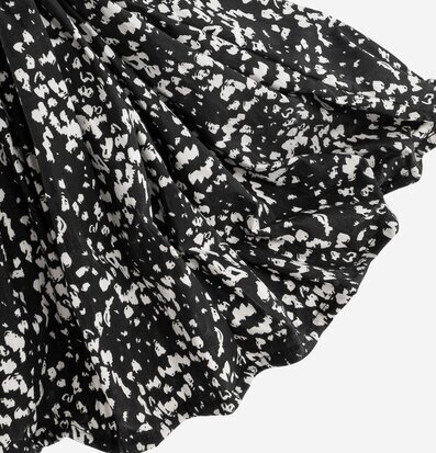 Bild av tyg med svartvitt mönster och textur