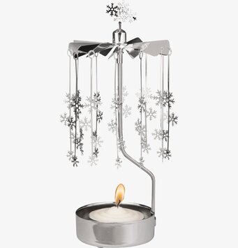 Foto av detaljrikt änglaspel med snöflingor i rörelse