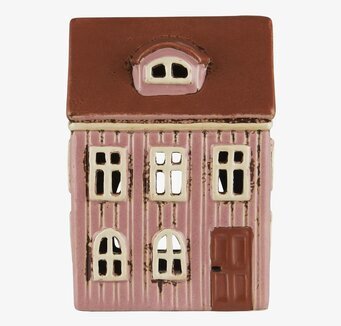 Bild av ljuslykta med husdesign och rosa keramik