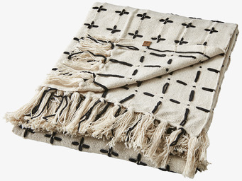 Foto av geometrisk filt med tofsar i svart och vitt