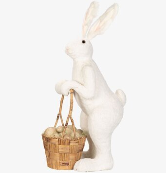 Foto av dekorativ hare med korg och ägg i vit färg