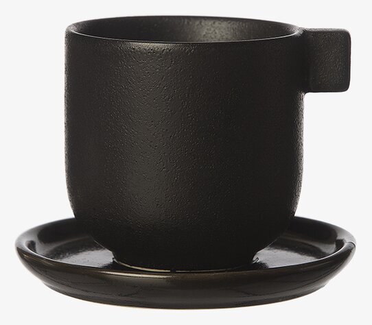 Foto av elegant kaffekopp med fat i svart design