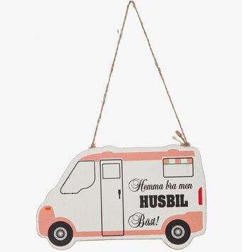 Bild av dekorativ skylt formad som husbil i pastellfärger