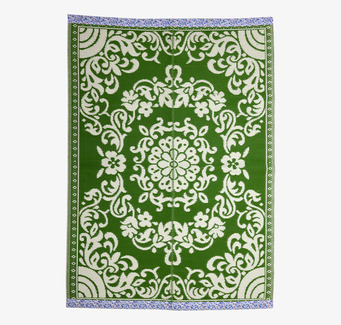 Bild av grön och elfenbensvit plastmatta med mönster