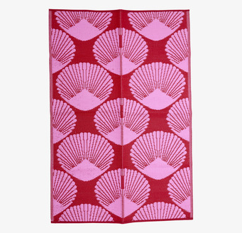 Bild av färgstark plastmatta med solfjädermönster