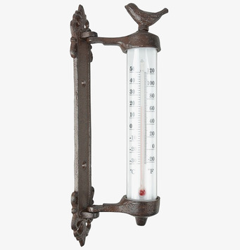 Bild av rustik termometer i gjutjärn med fågeldekor
