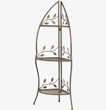 Foto av elegant grön metallhörnhylla med tre våningar