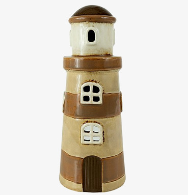 Foto av ljuslykta i form av en fyr för heminredning