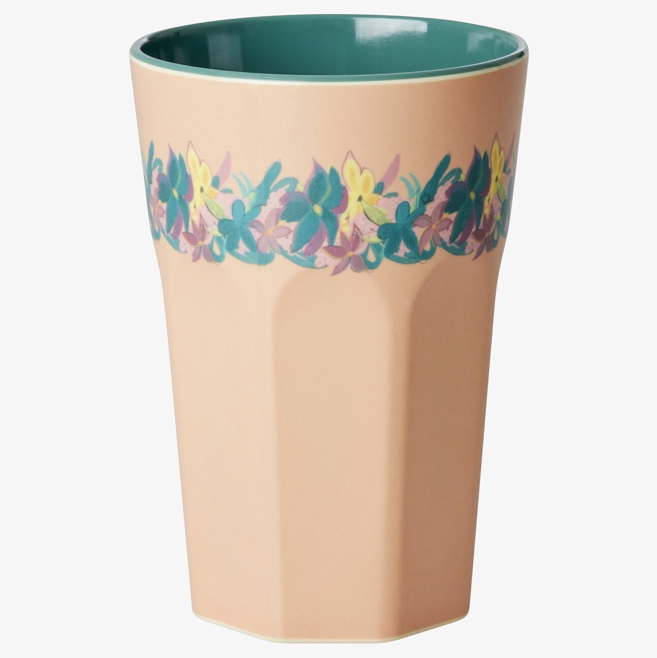 Bild av mugg med blommigt motiv och stilren design