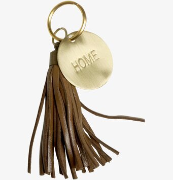 Foto av stilfull nyckelring med gyllene detaljer