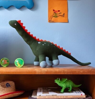 Bild av ett lekfullt barnrum med dinosaurietema