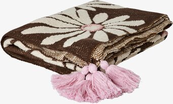 Bild av filt med blommönster och rosa tofsar