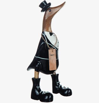 Bild av humoristisk träskulptur: Anka i bröllopskostym