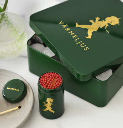 Bild av elegant plåtburk i grön och gyllene design