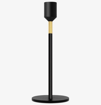 Bild av elegant, modern ljusstake med gulddetalj