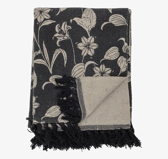 Bild av elegant pläd med naturmönster och fransar