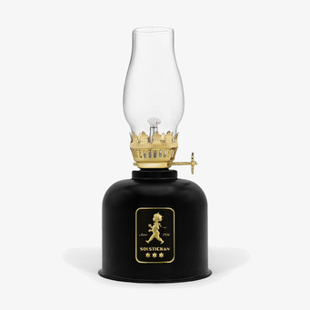 Bild av elegant fotogenlampa i svart och guld