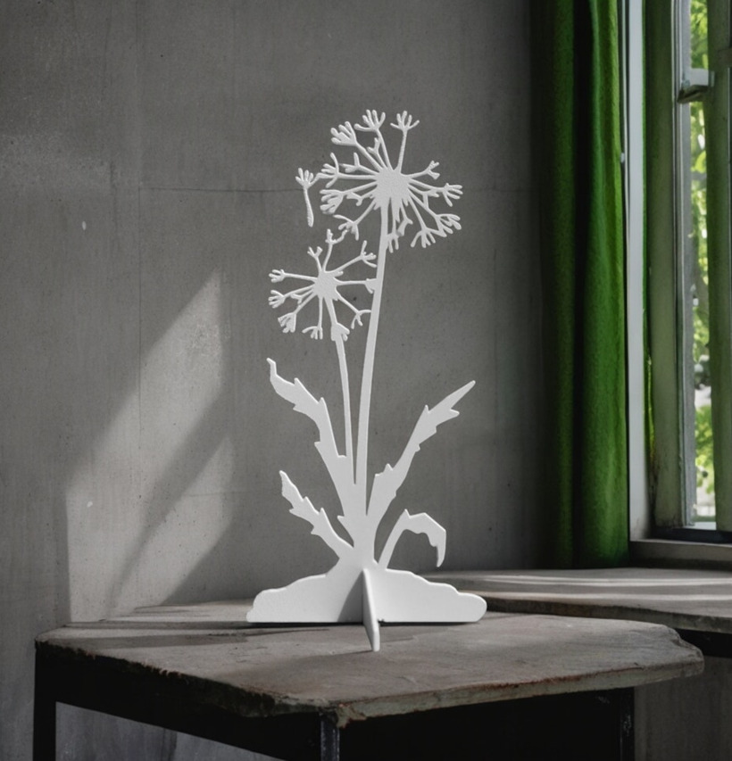 #ÄlskaPlåt Maskros Vit från Älskaplåt mot betongvägg