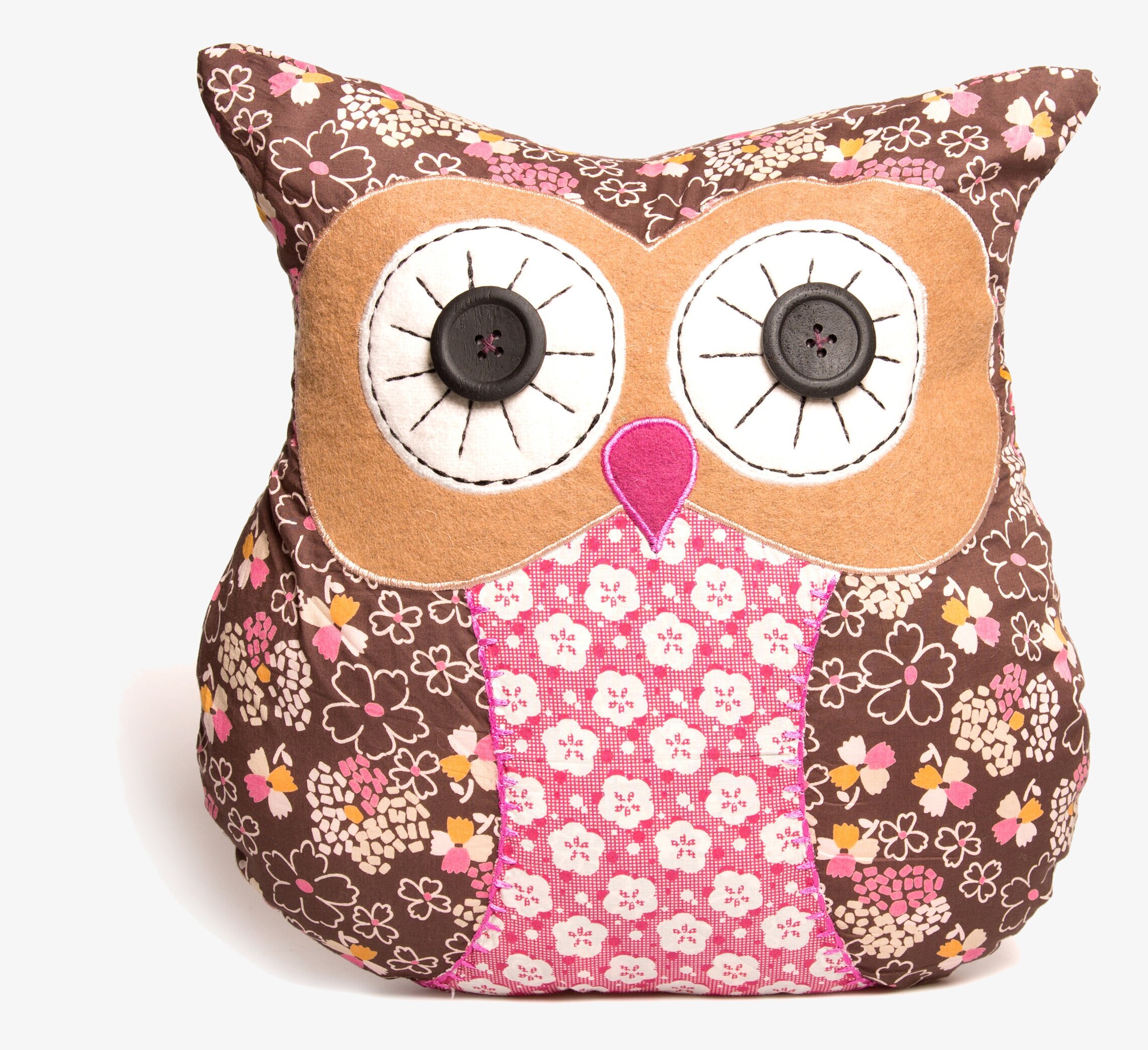Foto av kudde formad som uggla med blommigt mönster