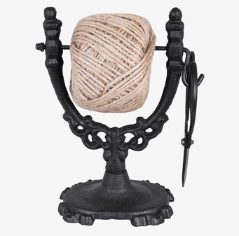 Bild av stilfull snörhållare i svart järn med sax