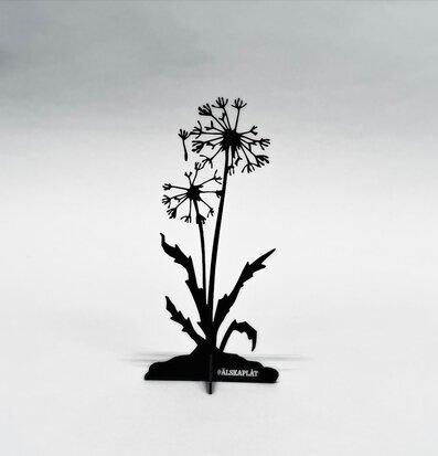 Bild av dekorativ plåtfigur som föreställer maskros