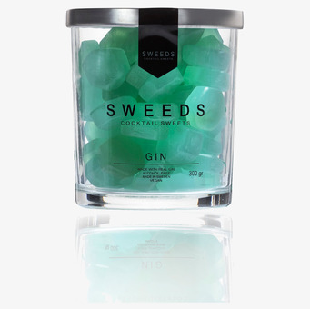 Bild av genomskinlig burk med turkosa godisbitar