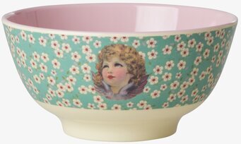 Bild av dekorativ skål med blommönster och barnansikte