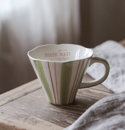 Foto av mugg med charmig design och subtila detaljer