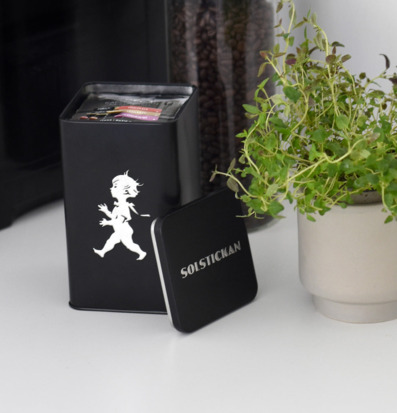 Bild av stilren svart kaffeburk med elegant design