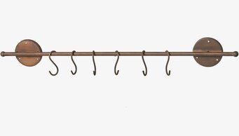 Bild av väggstång med krokar i antik metallfinish