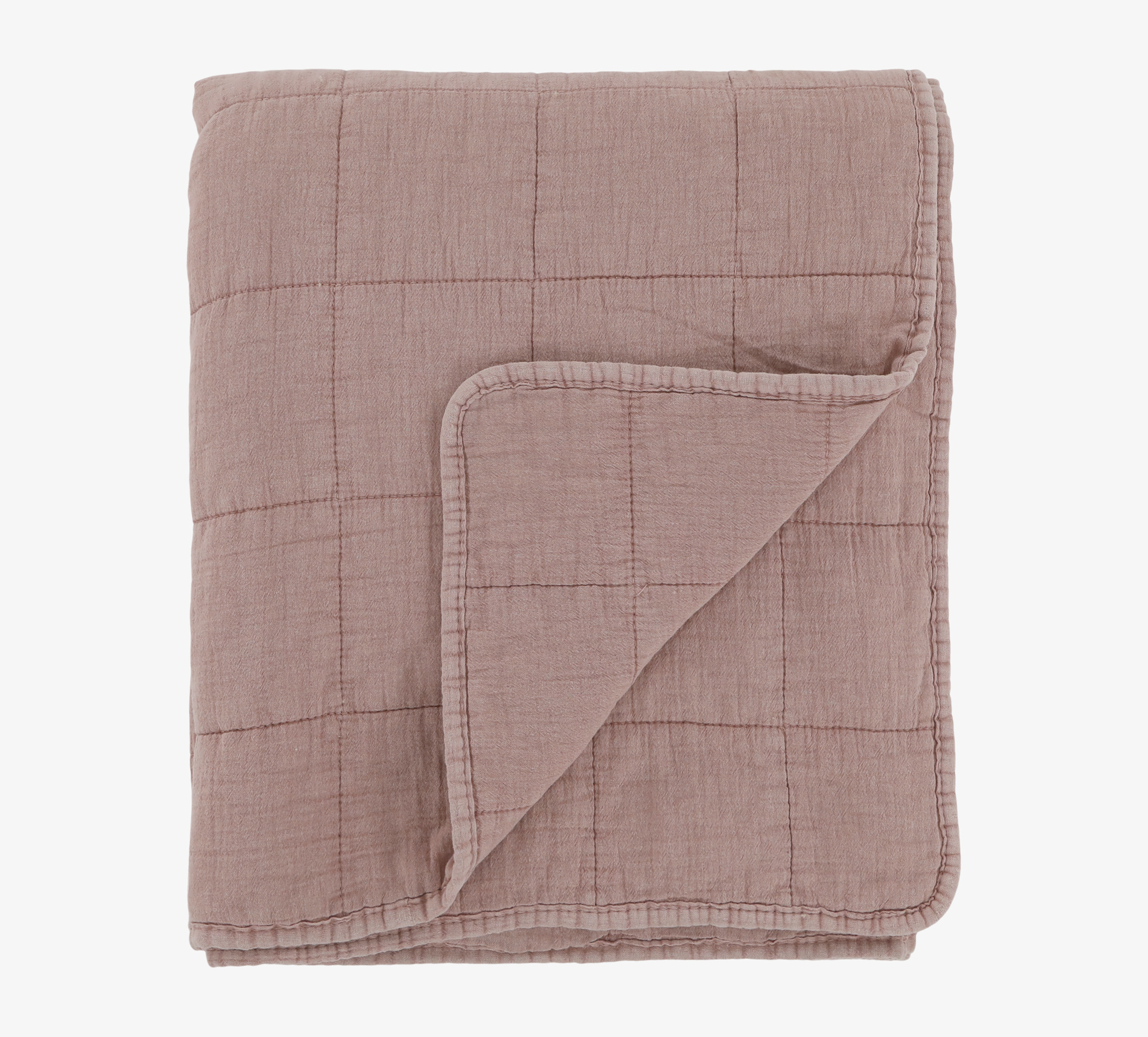 Bild av vackert kviltat överkast i vintage rosa