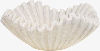 Bild av musselformad skål med naturinspirerad design