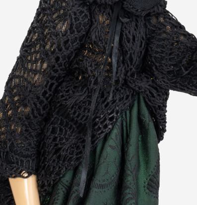 Bild av textilkomposition med svart och grön design