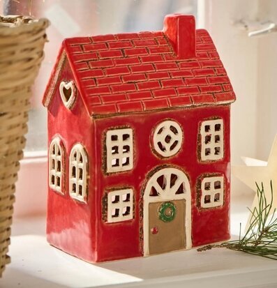 Bild av detaljrik ljuslykta i rött med festlig design