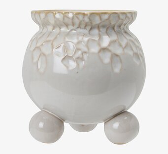 Bild av en elegant offwhite keramikkruka med reliefmönster