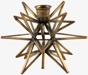 Bild av en stjärnformad ljushållare i antik mässing