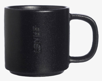 Bild av stilren svart mugg med modern och traditionell design