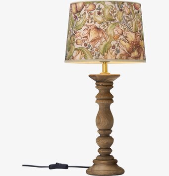 Bild av bordslampa med rustik design och blommönster