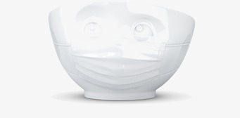 Bild av unik porslinsskål med mask och ögon-design