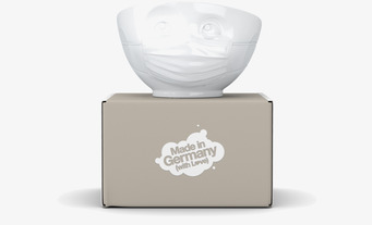 Bild av unik porslinsskål med lekfull design och mask