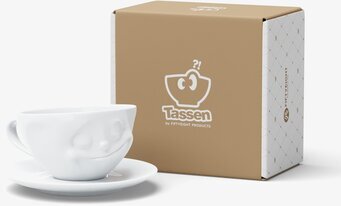 Bild av unik kaffekopp med ansikte och elegant förpackning