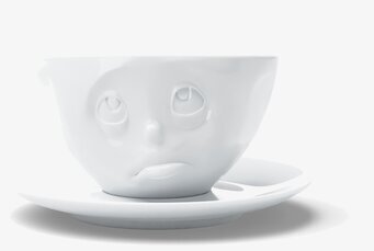 Bild av unik kaffekopp med fat och ansiktsdesign