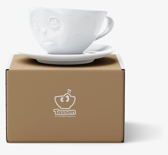 Bild av unik kaffekopp med ansikte och fat i porslin