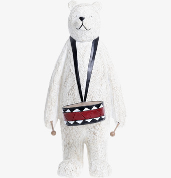 Bild av charmig björnfigur med trumma och geometriska mönster